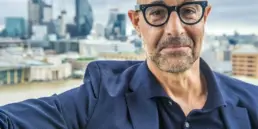 Stanley Tucci wearing thick rimmed vintage glasses frame uai